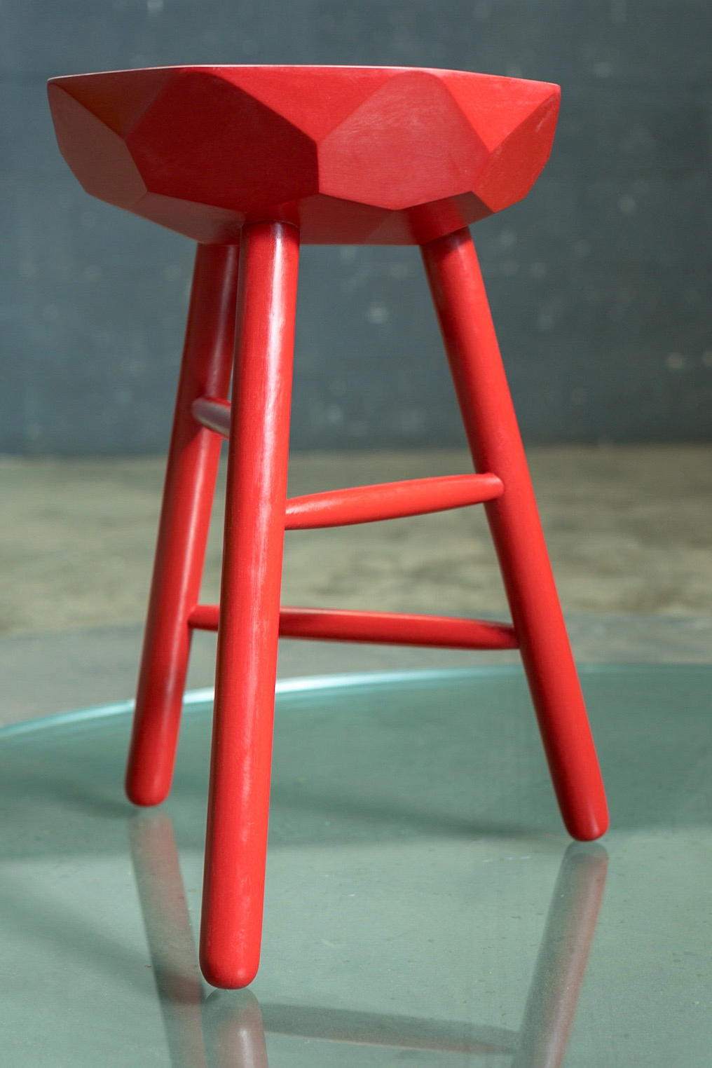 Small transformed stool with jewel-like colour and surface detail.
