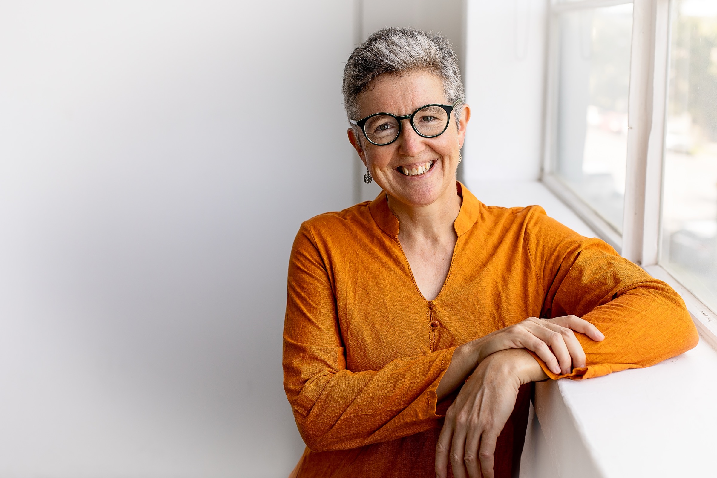 Holly Kay Parsons working with upholstery materials by hand.